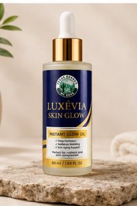 LUXEVIA Skin Glow facial oil bottle in a calm bathroom setting with a folded towel
